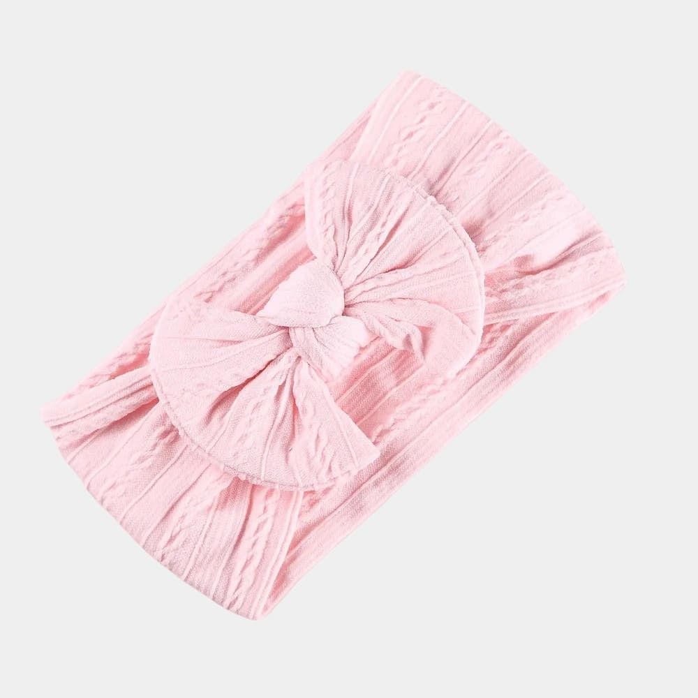 Bandeau bébé rose pâle avec gros nœud